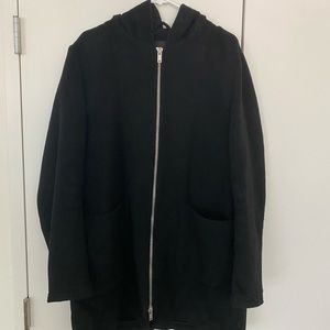 Hooded winter jacket. Parka length.